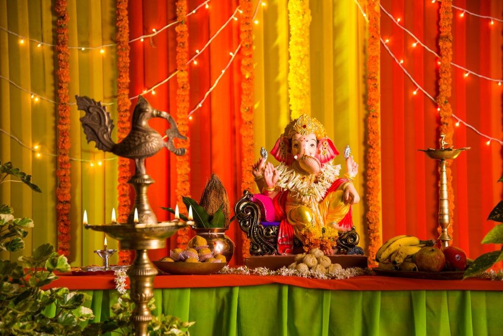 beautiful-clay-statue-idol-indian-hindu-god-lord-ganesha-decorated-with-colourful-drapery-marigold-garland-ganesh-chaturthi-festival-celebration-pooja-min.jpg