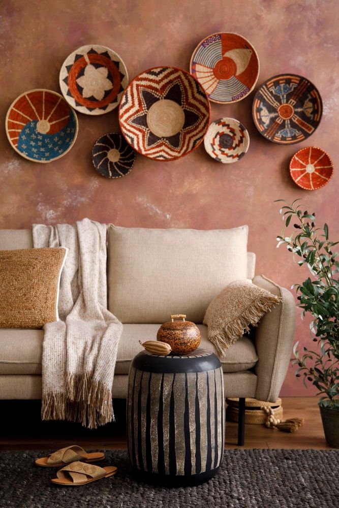stylish-boho-compostion-living-room-interior-with-design-beige-sofa-coffee-table-wicker-baskets-elegant-personal-accessories-brown-white-pillows-plaid-cozy-apartment-home-decor-min.jpg